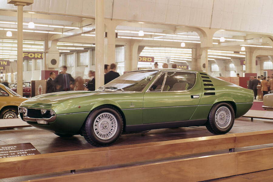 Green 1970 Alfa Romeo Montreal on a motor show stand â€“ front quarter