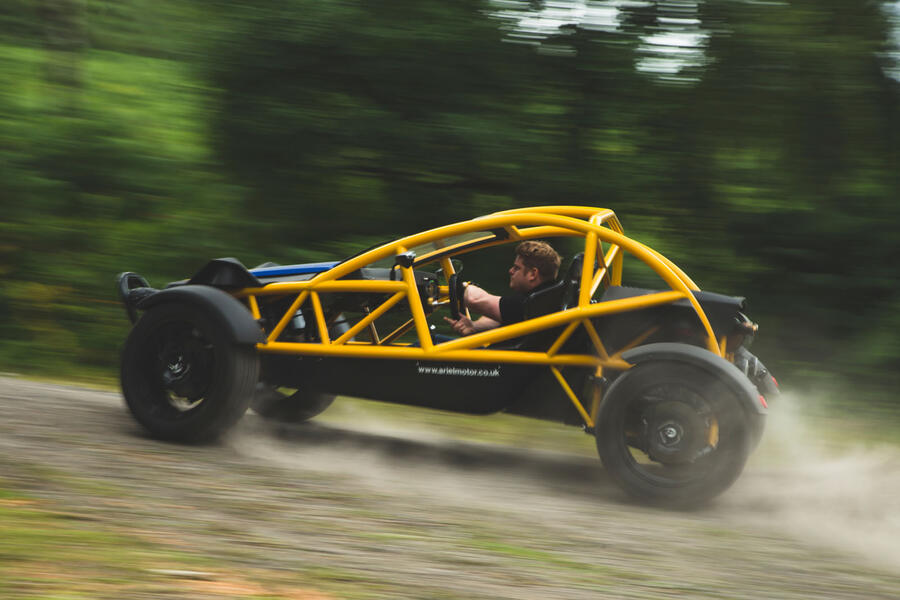 Ariel Nomad sliding through corner â€“ side