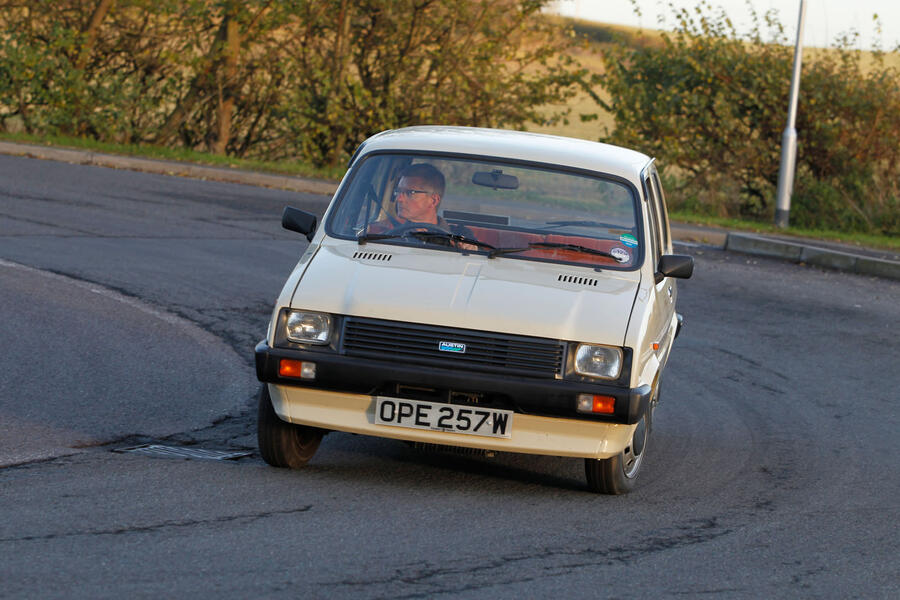 Beige Mk1 Austin Metro leans while cornering – front