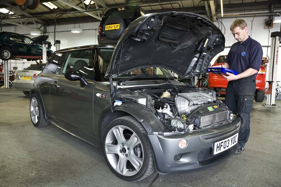 Dealer working on car mini cooper