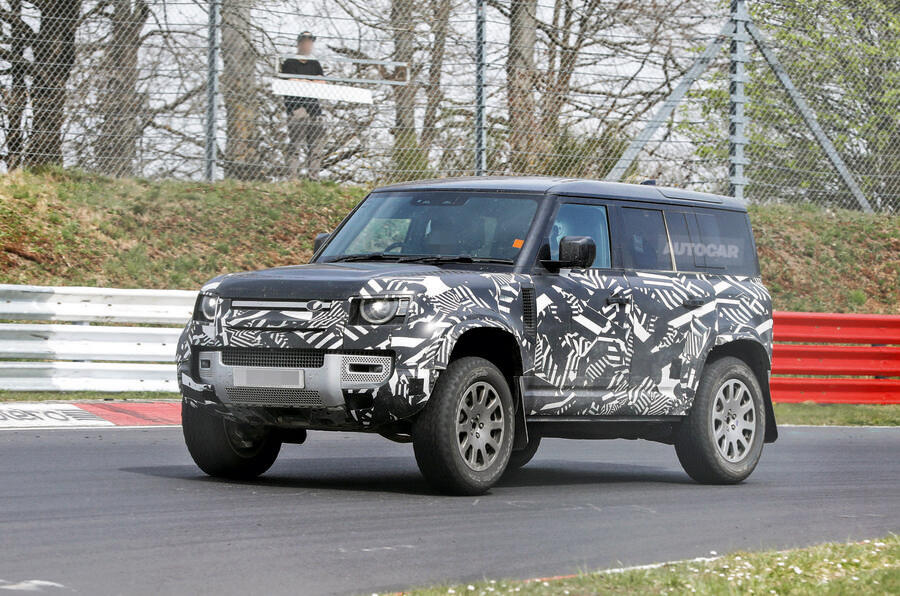 Defender Octa driving on Nurburgring â€“ camouflaged, front