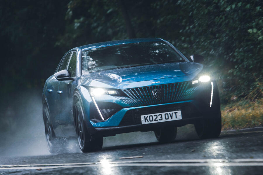 Peugeot 408 driving in the rain  front