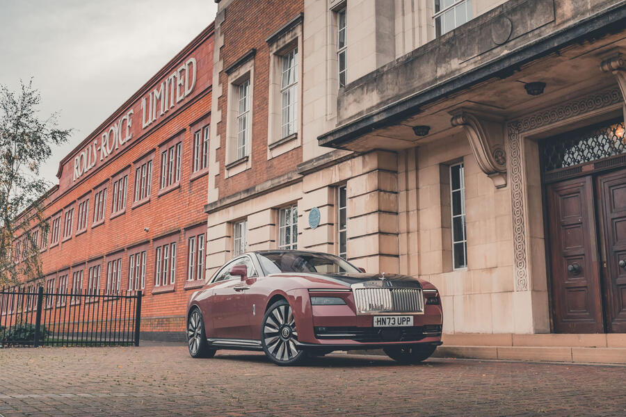 Rolls-Royce Spectre in front of Rolls-Royce Derby plant