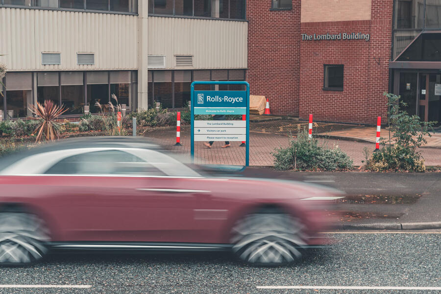 Rolls-Royce Spectre driving past Derby plant