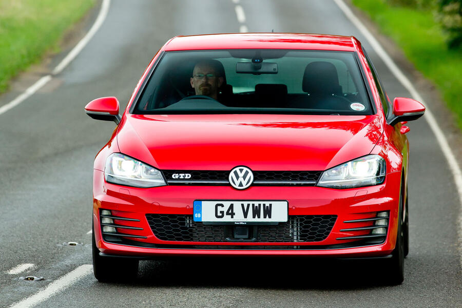 Red Mk7 Volkswagen Golf GTD driving â€“ front tracking